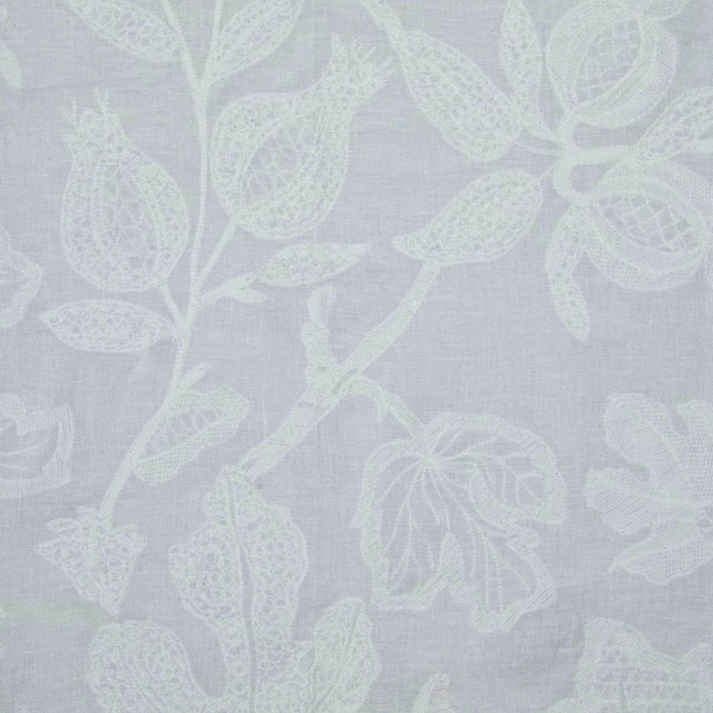 Pale blue-grey fabric with large ivory leaves, seedpods and botanical stems
