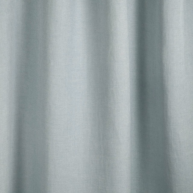 Pale aqua plain-weave fabric showing soft vertical folds and subtle blue-green tonal variation