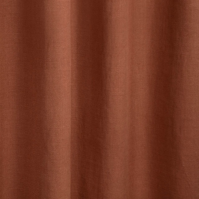 Warm blush terracotta textile with subtle vertical striations and softly folded sheen