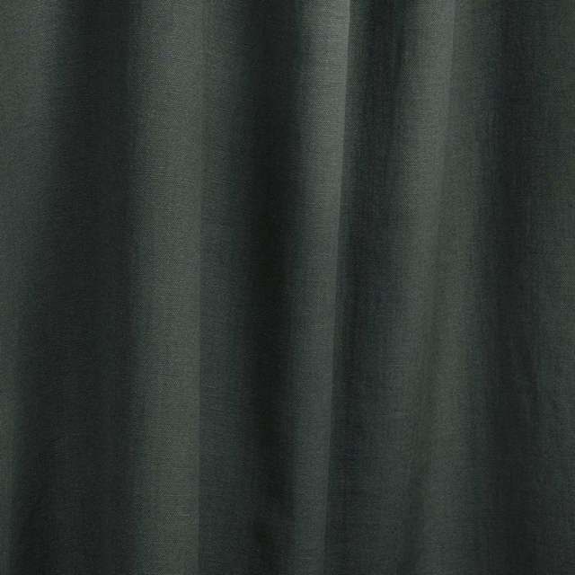 Deep cedar-green fabric with soft folds and subtle vertical sheen
