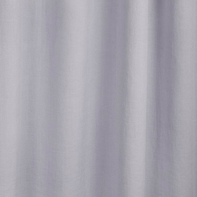 Pale lilac-grey plain fabric with fine texture falling into soft vertical folds