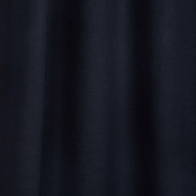 Deep marine-blue textile with soft vertical folds and subtle surface texture