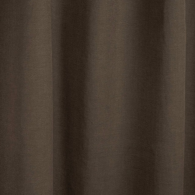 Muted taupe plain weave fabric forming soft vertical folds with subtle earthy texture