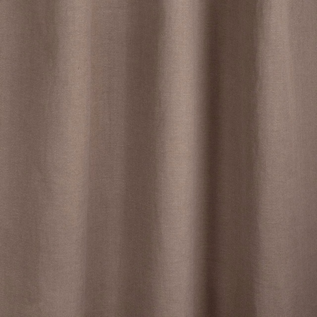 Muted warm taupe plain fabric with fine texture falling into soft vertical folds
