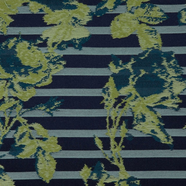 Navy striped textile with olive botanical sprays and a softly ridged woven surface