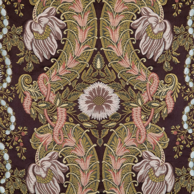 Deep plum textile with mirrored pink, sage, ivory and gold floral motifs