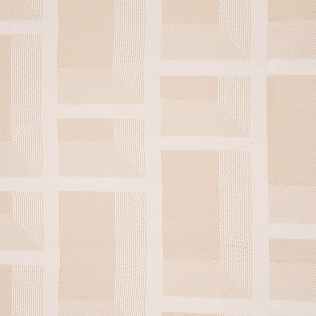 Pale natural woven textile with softly outlined rectangular block motifs