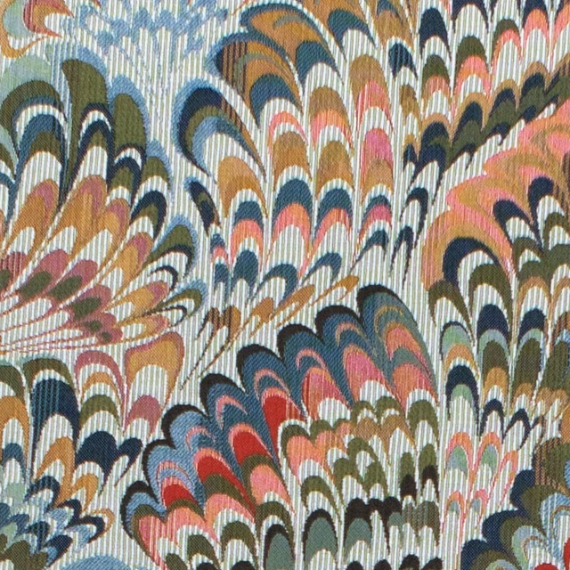 Celadon fabric with dense scalloped fans in coral, navy, olive and ochre