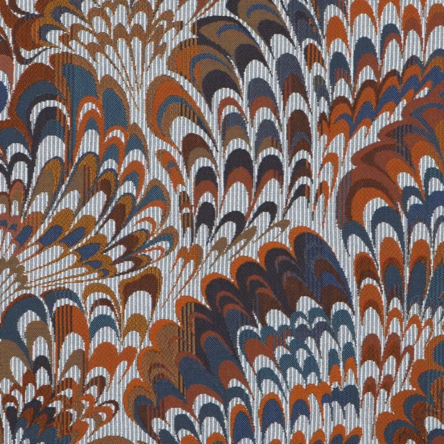 Indigo textile with rust, brown and cream fan-like feather motifs in a dense weave