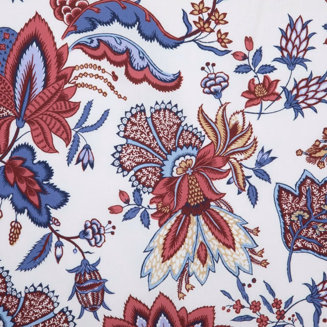 Cream botanical fabric with garnet flowers, blue leaves and paisley motifs