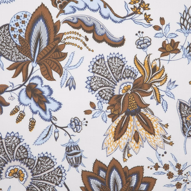 Ivory floral fabric with faded blue, brown and ochre botanical motifs