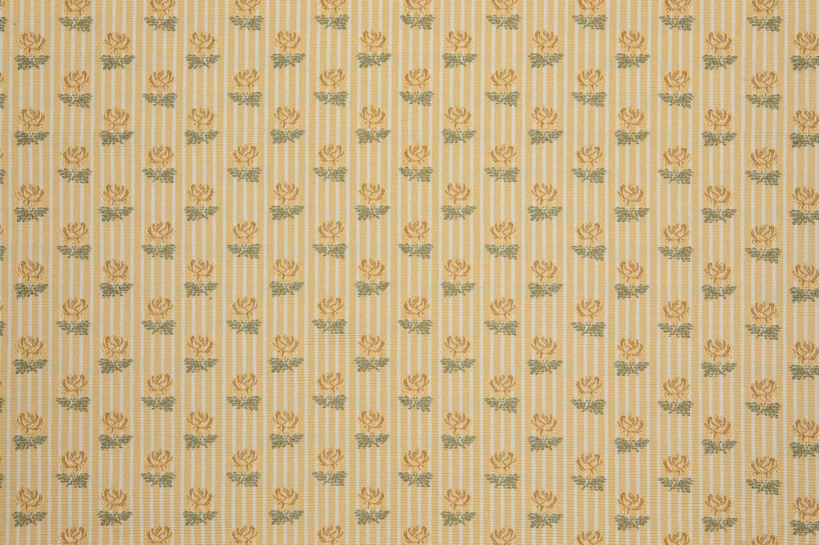 Warm cream textile with narrow gold stripes and muted botanical sprigs