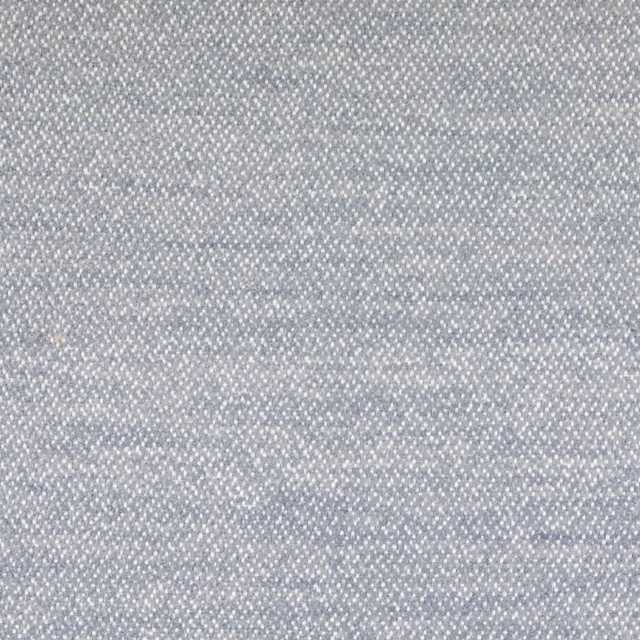 Pale smoky blue-grey woven textile with fine mottled texture and subtle horizontal tonal variation