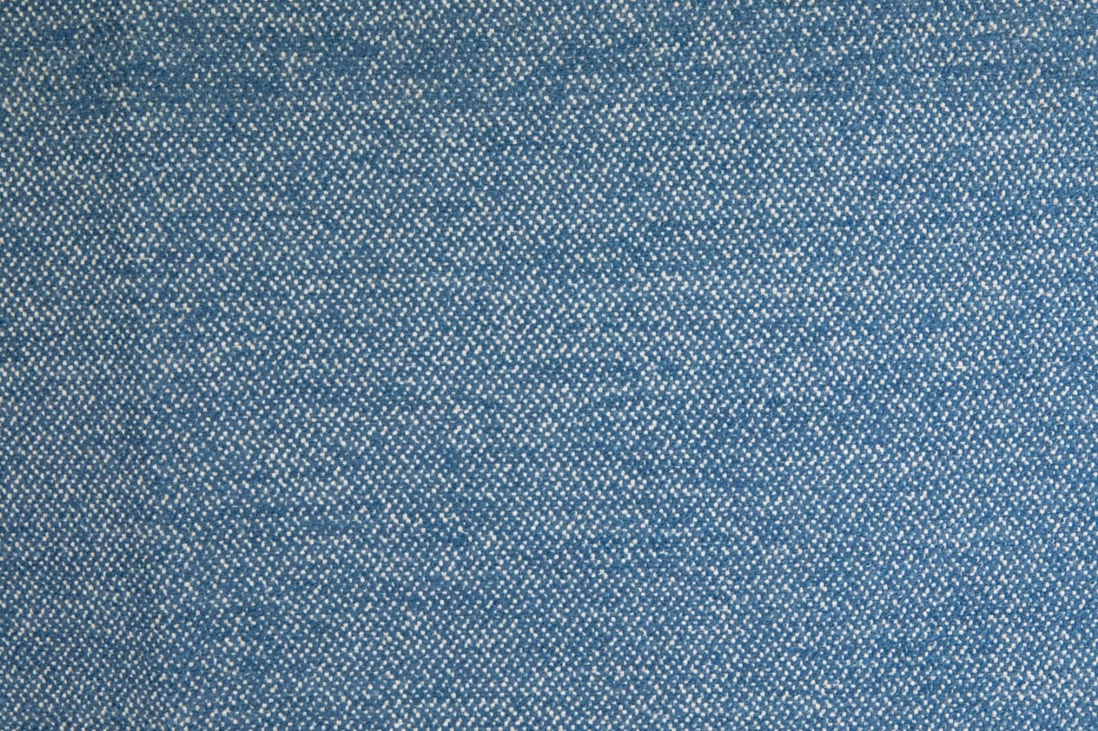 Cool ocean-blue woven textile with fine pale flecks and a softly tactile surface