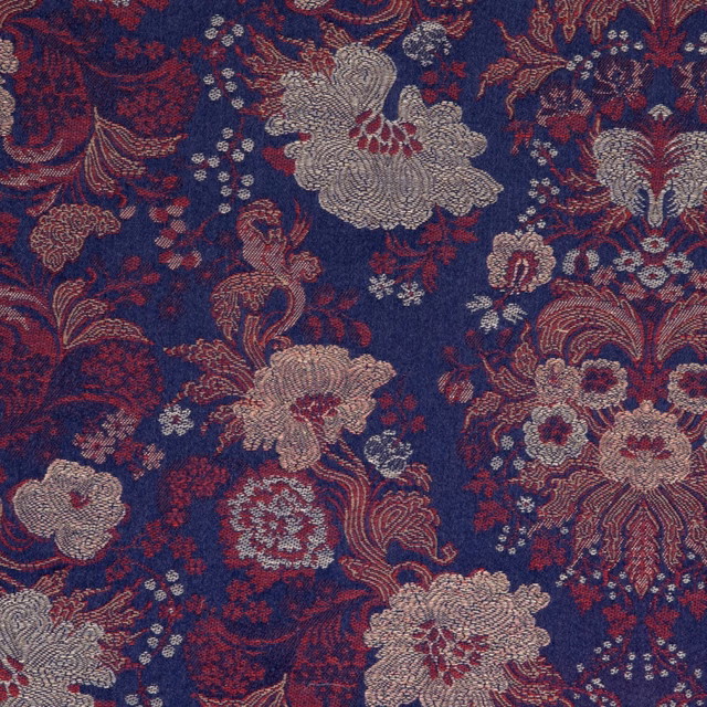 Ink-blue floral and paisley textile with burgundy, taupe and dusty rose woven motifs