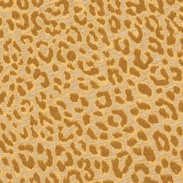 Warm ochre animal spots across a nubby ivory-beige woven ground