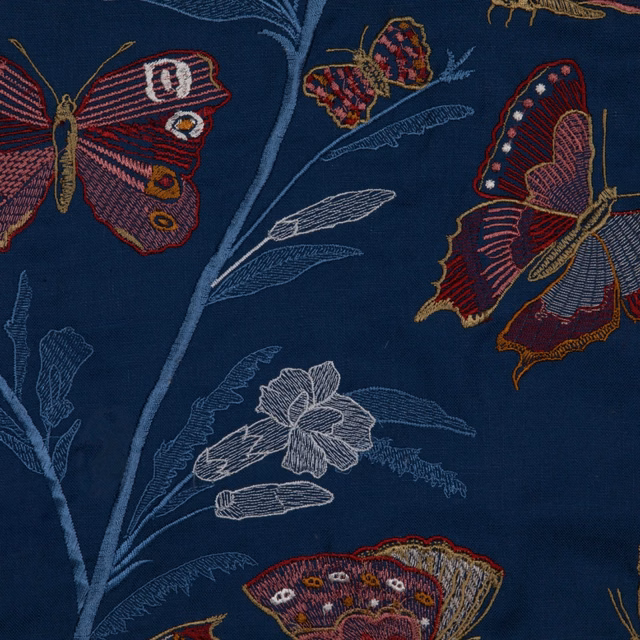 Ink navy fabric with jewel-toned butterflies and pale botanical stems