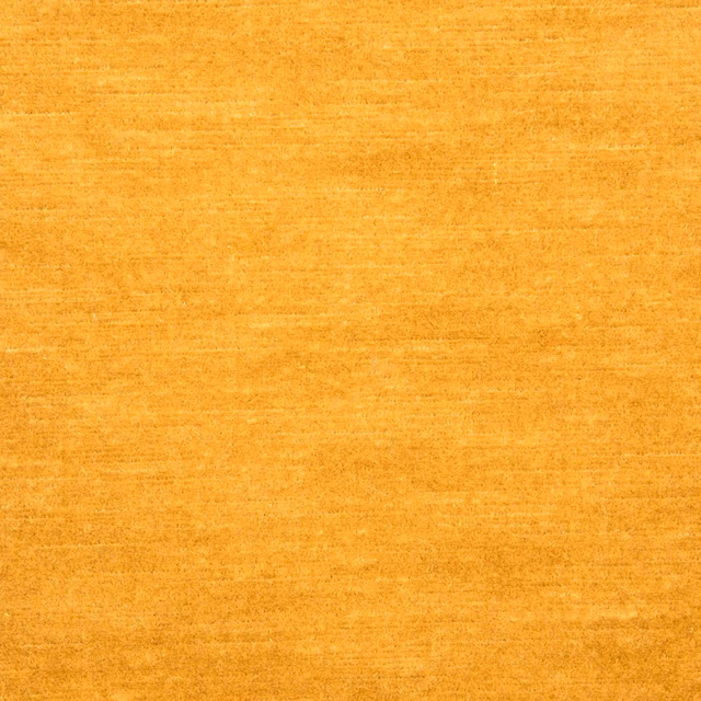 Warm golden ochre fabric with fine horizontal striations and softly mottled texture