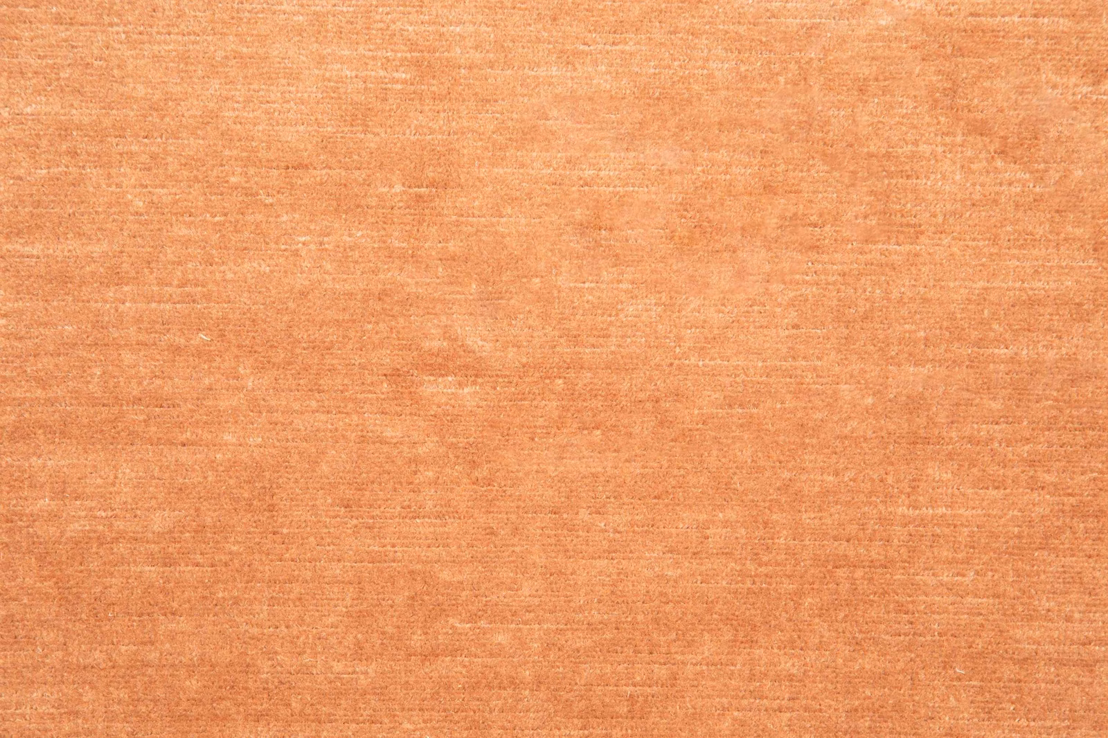 Warm cinnamon-terracotta textile with fine horizontal striations and softly brushed texture