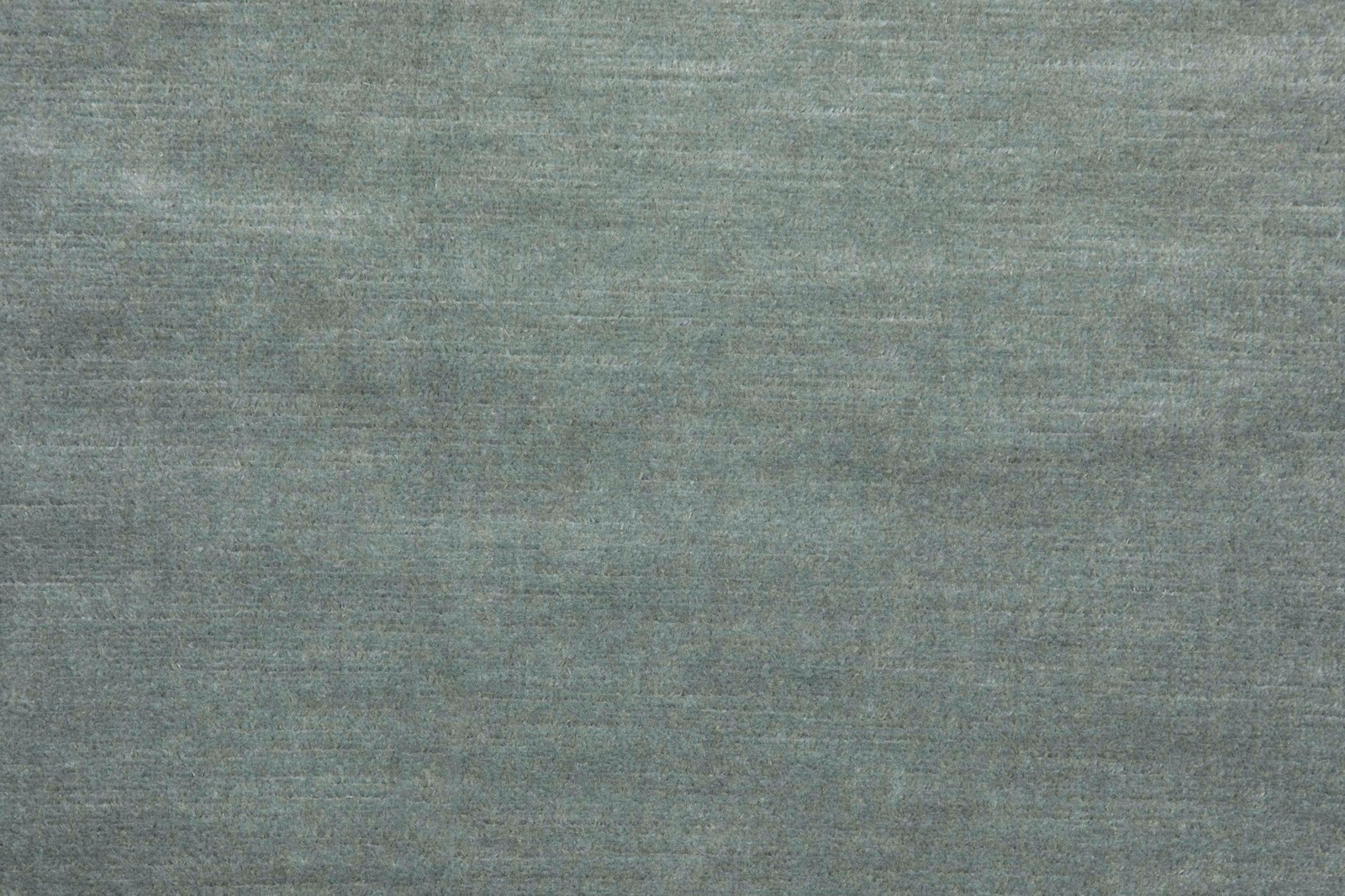 Muted celadon grey-green fabric with fine horizontal striations and soft woven tonal variation
