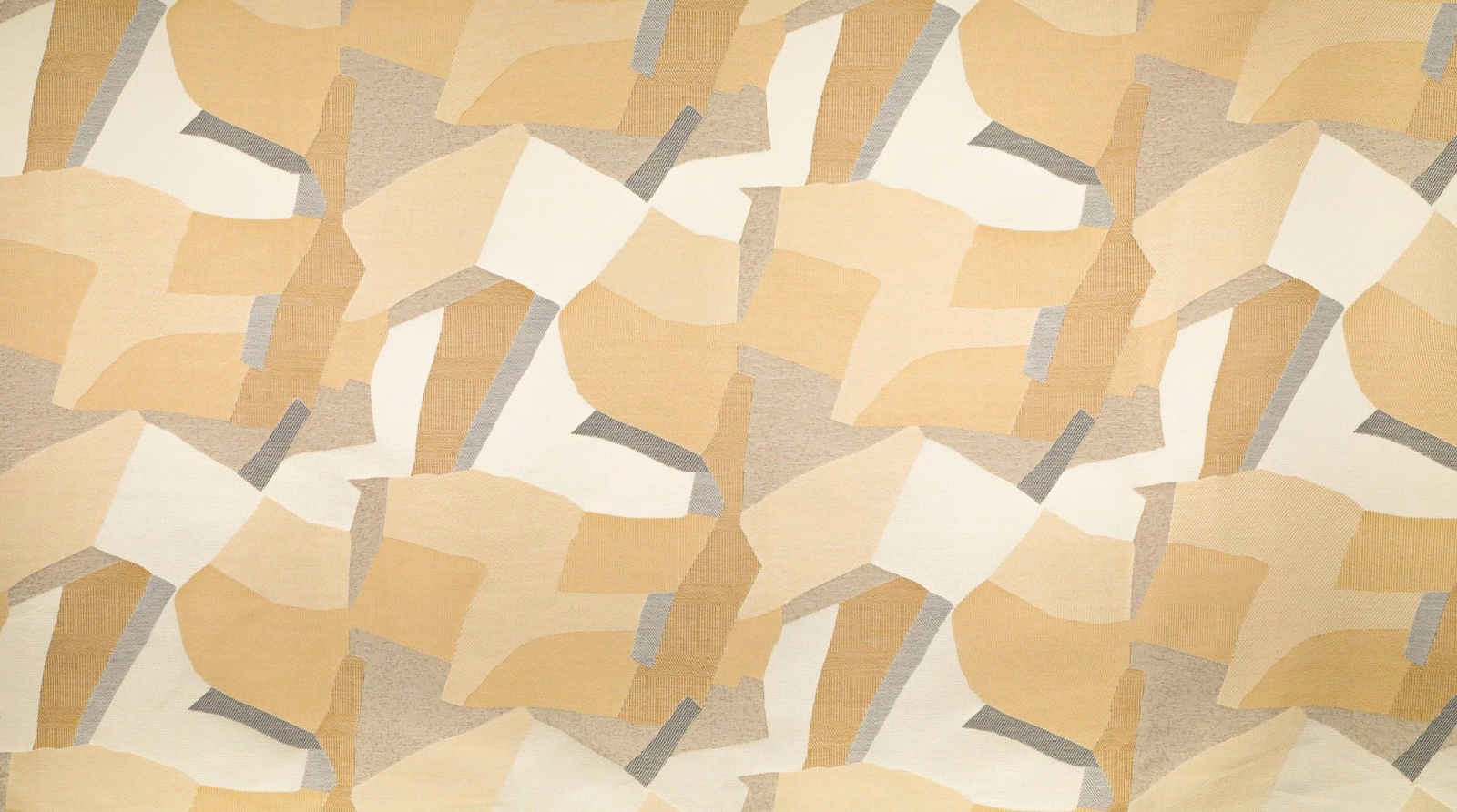 Warm sand, cream and pale grey angular patchwork on a softly textured textile swatch