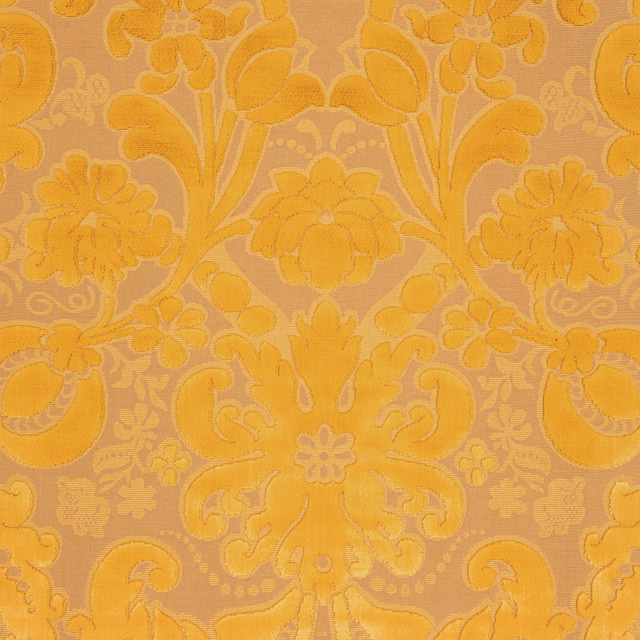 Golden ochre Honore damask with symmetrical scrolling flowers and softly raised tonal texture