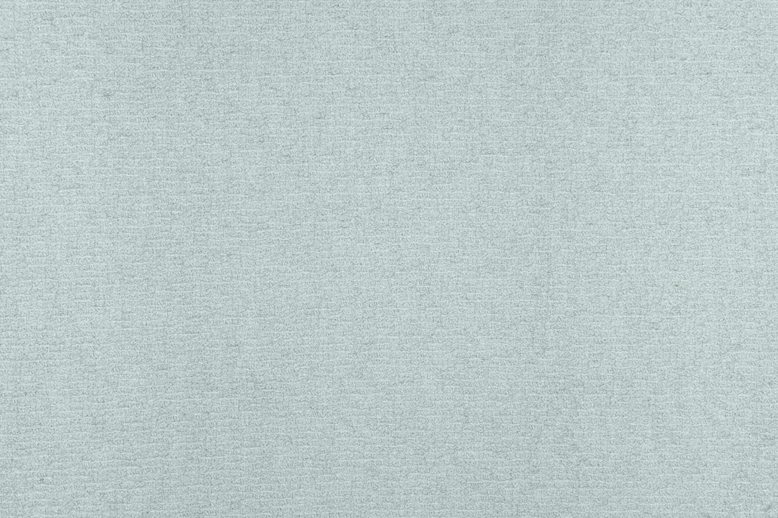 Pale celadon woven textile with a softly irregular, fine-grained surface
