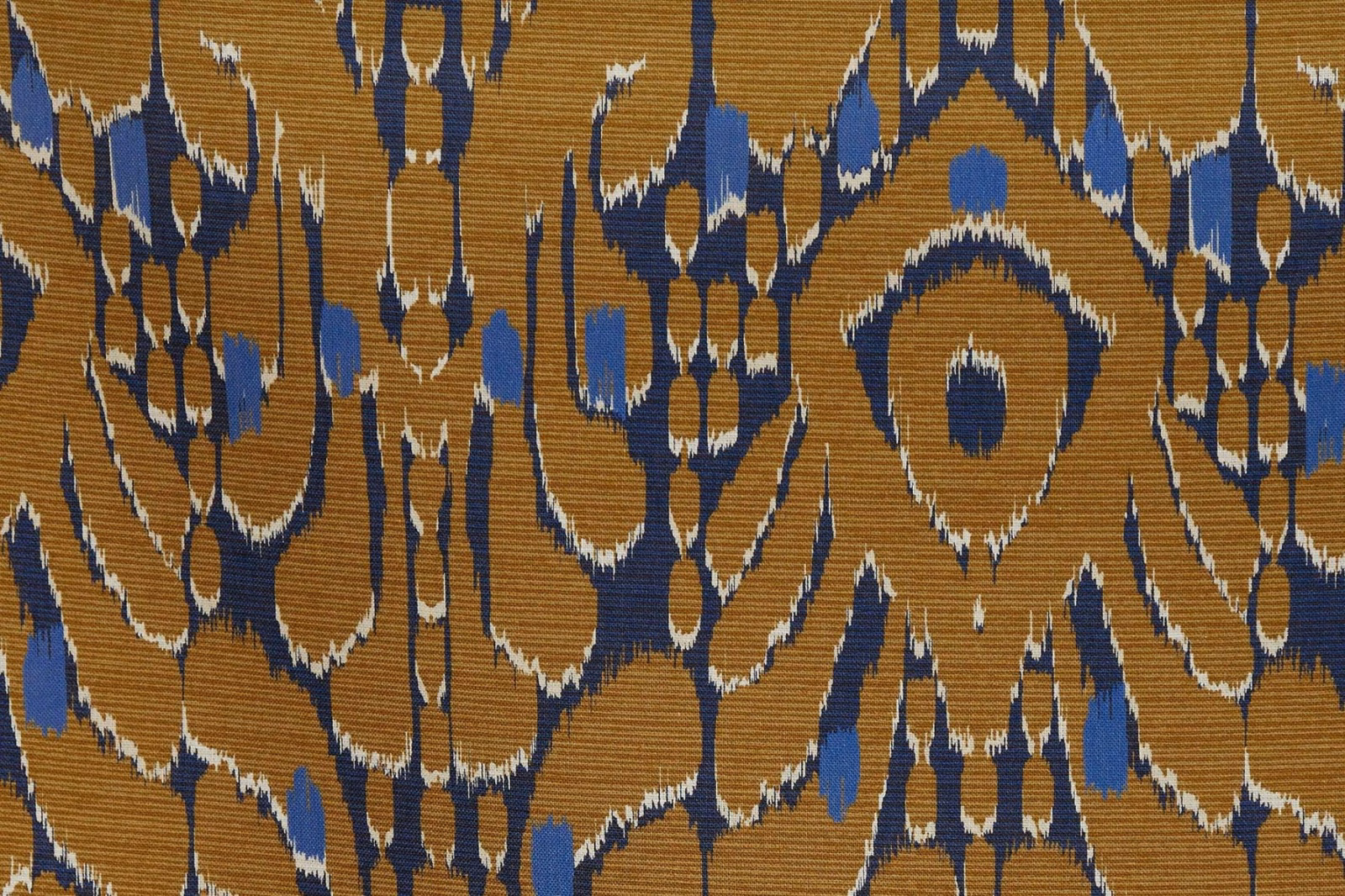 Camel ribbed fabric with bold ink-blue and ivory abstract ikat motifs