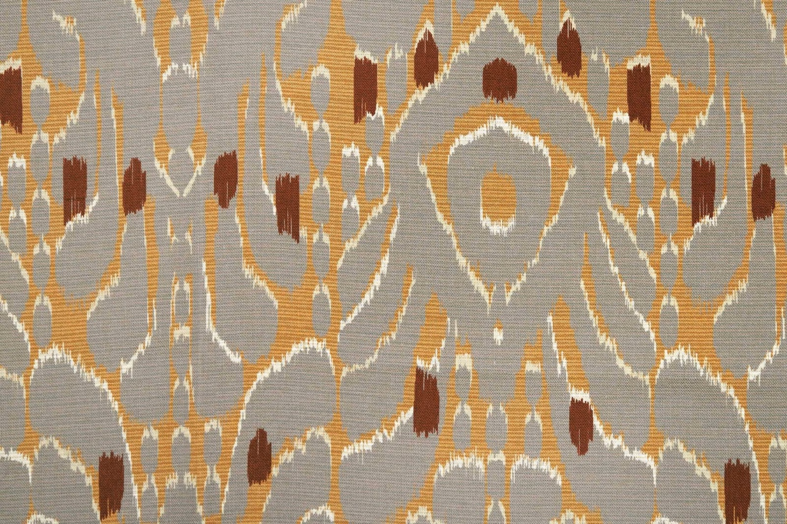 Tourterelle ikat textile with taupe-grey ground, ochre, rust and ivory motifs