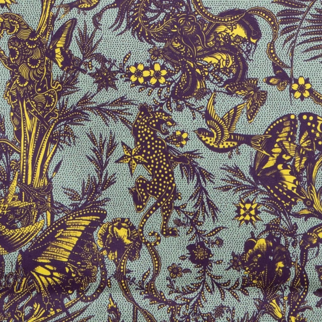 Celadon botanical fabric with plum foliage, butterflies, birds and bright yellow flowers