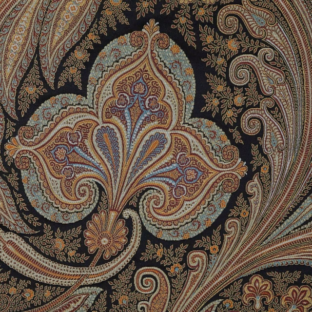 Near-black woven fabric with large rust, teal and blue paisley motifs