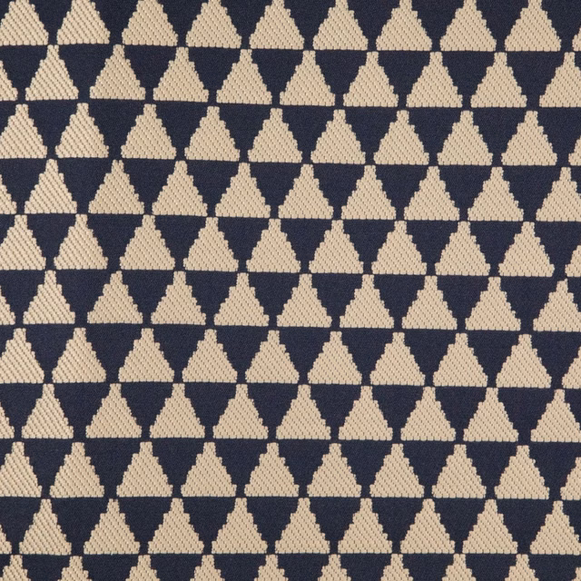 Marine blue and cream woven fabric with a tightly repeated diamond motif
