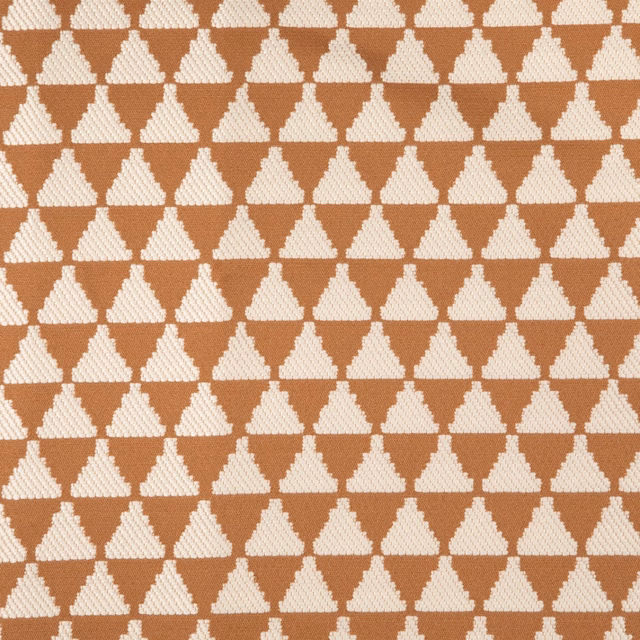 Warm terracotta textile with small cream diamond lattice and fine woven texture