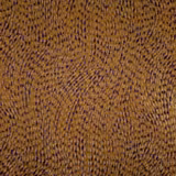 Warm amber-brown textile with dense irregular flecks and subtly ridged weave