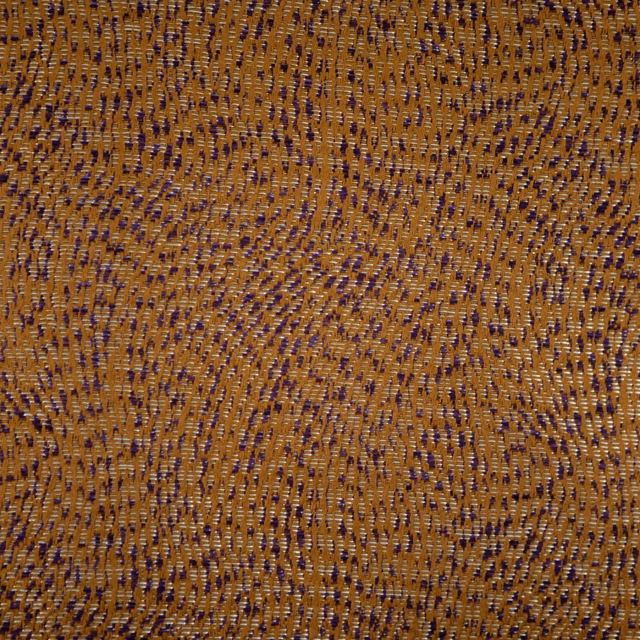 Warm amber-brown textile with dense irregular flecks and subtly ridged weave