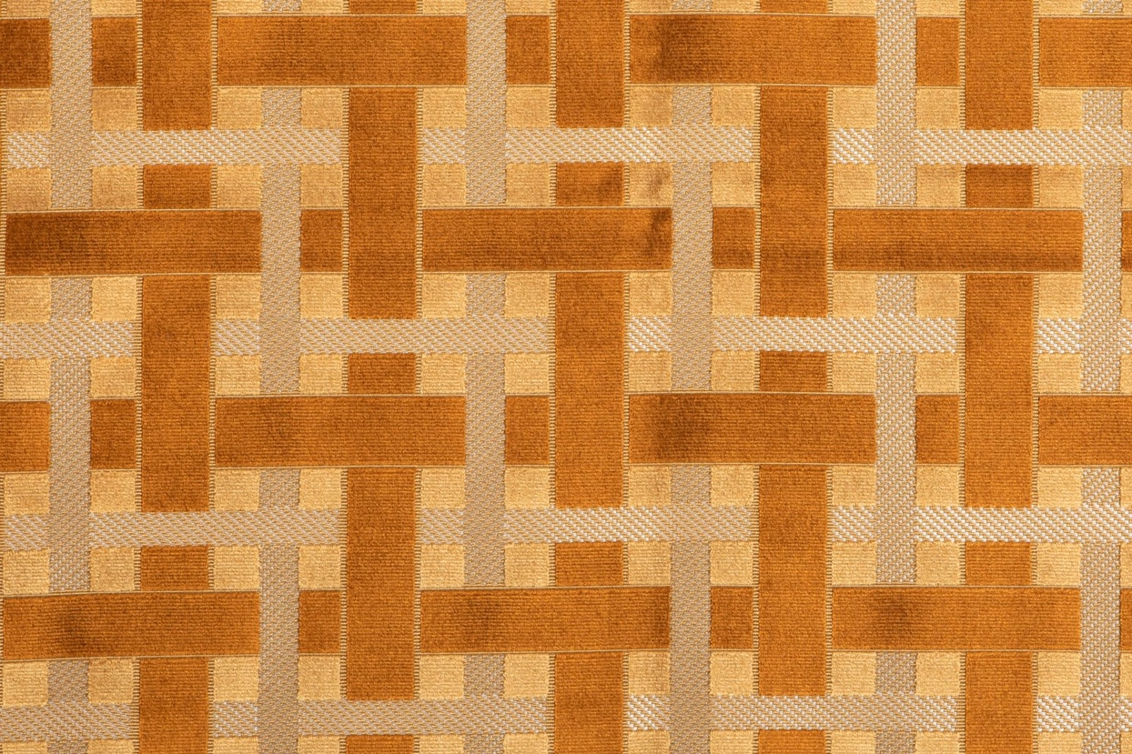Amber-gold woven fabric with interlocking caramel blocks and pale beige textured bands