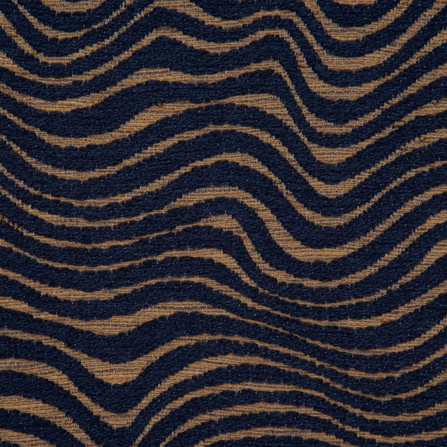 Dark navy textile with irregular ochre wave bands and a tactile woven surface