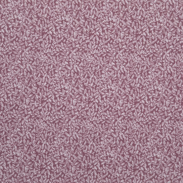 Dusty rose fabric with dense pale pink botanical tracery and a softly stippled surface