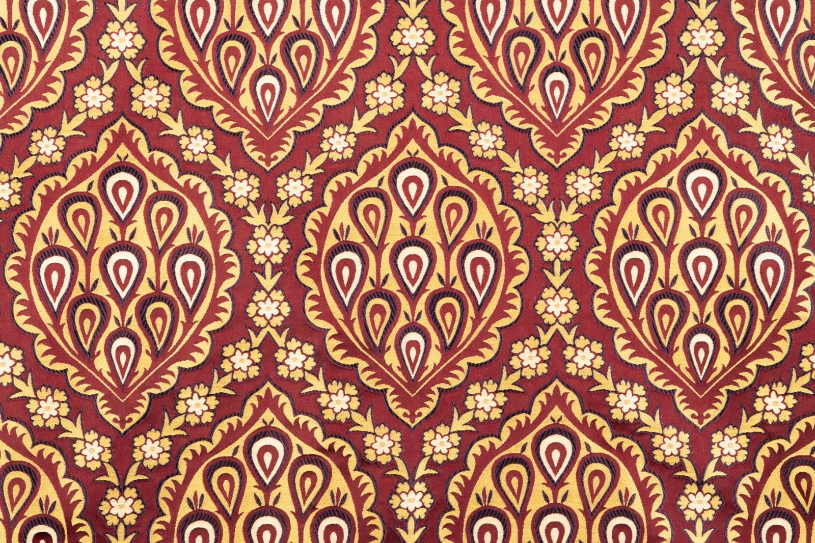Garnet textile with cream paisley damask medallions and ochre floral detailing