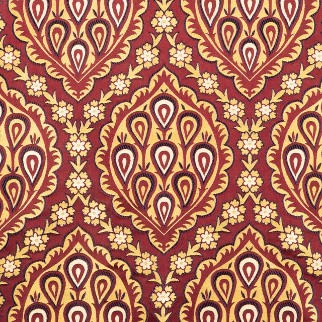 Garnet textile with cream paisley damask medallions and ochre floral detailing