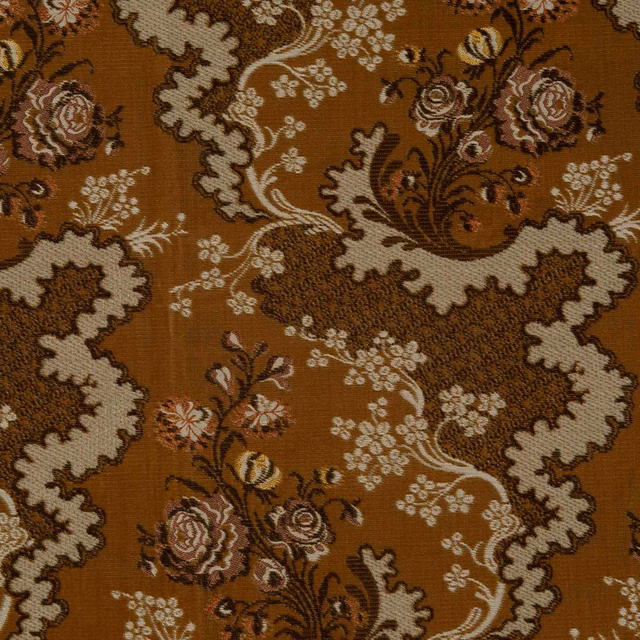 Bronze-brown floral textile with cream scrolls and muted rose bouquets