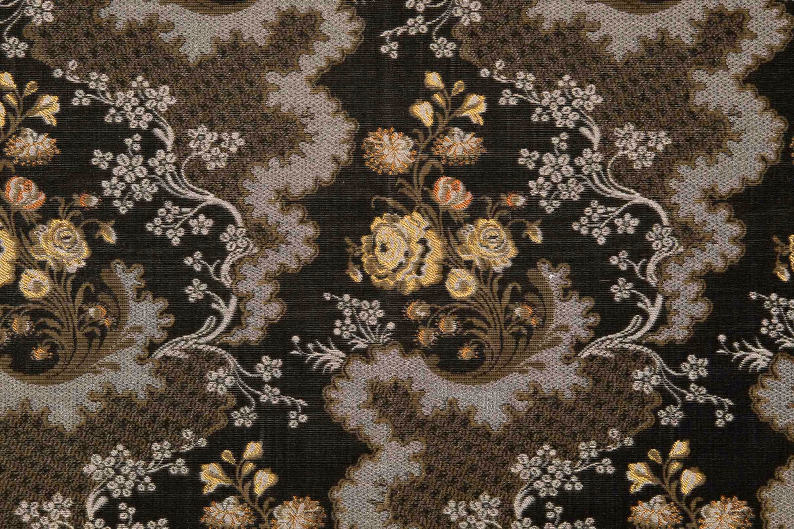 Olive-black woven ground with scalloped stone-grey bands and antique gold flowers