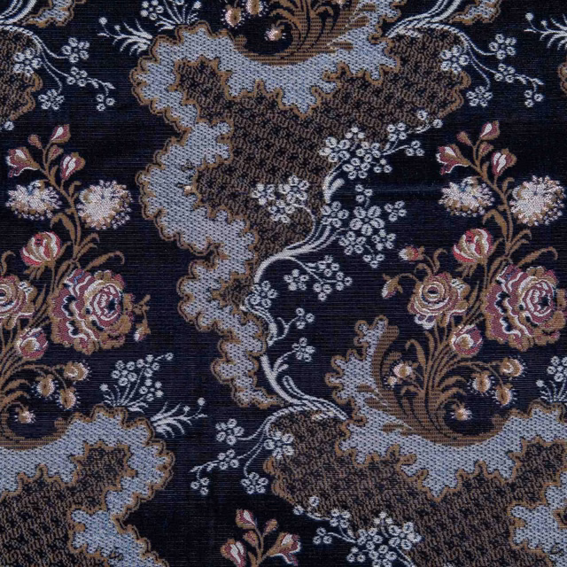 Dark navy woven ground with pale blue paisley, sepia scrolls and dusty rose flowers