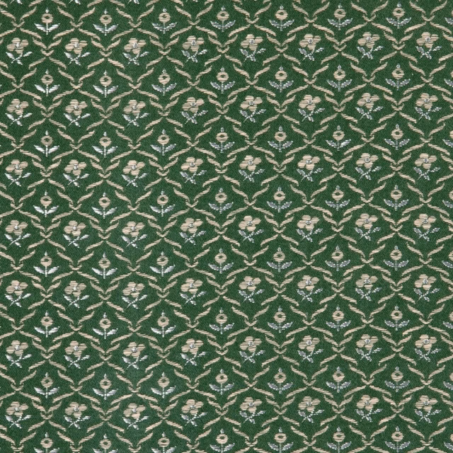 Deep moss green fabric with repeating cream floral sprigs in a small lattice