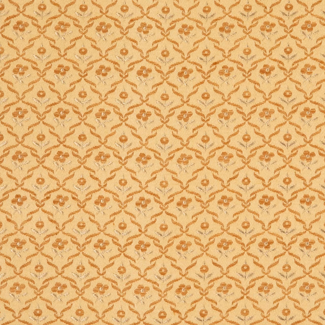 Warm doré-gold textile with a small ochre floral lattice and textured surface