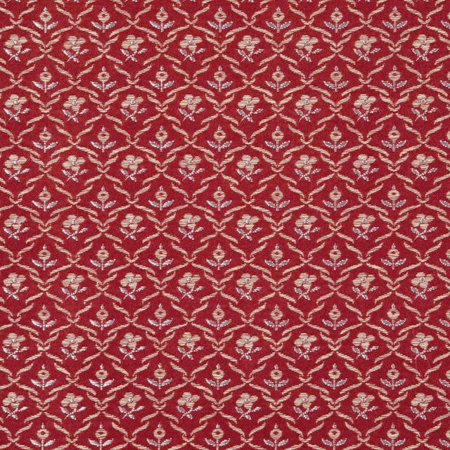 Deep garnet fabric with repeating cream floral trellis and fine woven texture