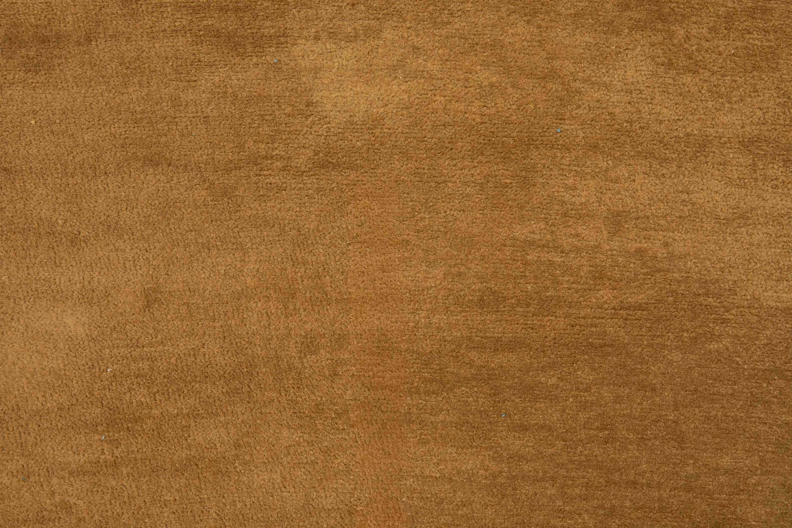 Warm bronze-brown fabric with softly brushed, finely mottled texture and subtle tonal depth