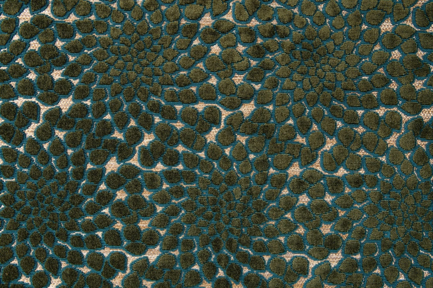 Teal and olive pebble-patterned woven fabric with cream irregular outlines