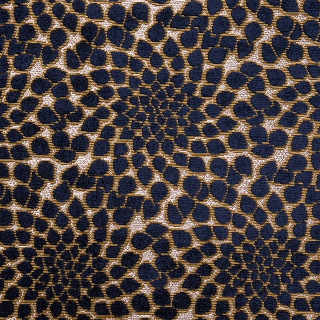 Deep navy textile with bronze-gold cellular pebble weave and richly textured surface