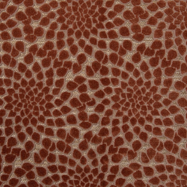 Russet terracotta textile with dense pale taupe irregular cellular pattern